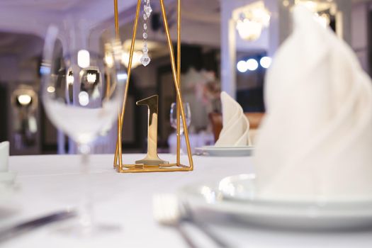 Beautiful setting of the wedding banquet table in the restaurant.