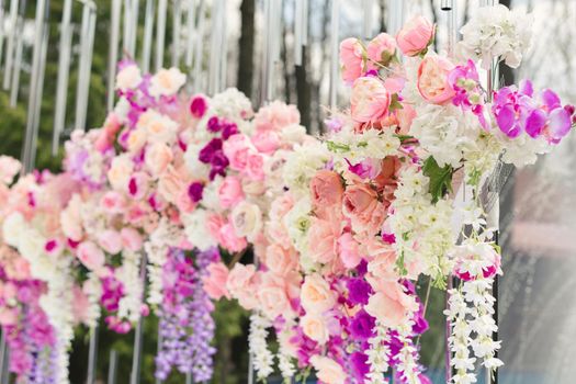 Details. Wedding ceremony in the open air of fresh flowers. Gentle and beautiful wedding decor for newlyweds.