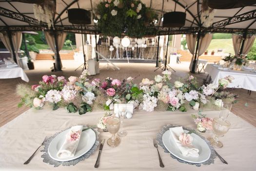 Beautiful setting of the wedding banquet table in the restaurant.