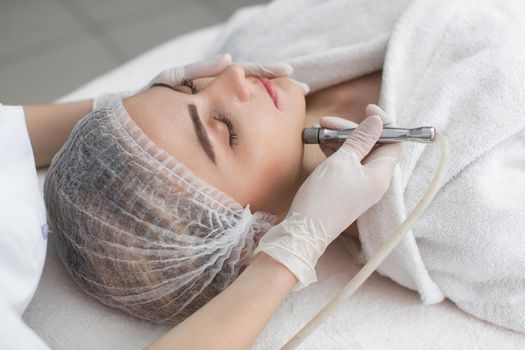 Face Skin Care. Close-up Of Woman Getting Facial Hydro Microdermabrasion Peeling Treatment At Cosmetic Beauty Spa Clinic. Hydra Vacuum Cleaner. Exfoliation, Rejuvenation And Hydratation. Cosmetology.