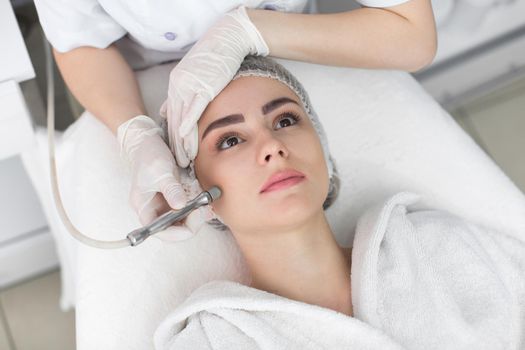 Face Skin Care. Close-up Of Woman Getting Facial Hydro Microdermabrasion Peeling Treatment At Cosmetic Beauty Spa Clinic. Hydra Vacuum Cleaner. Exfoliation, Rejuvenation And Hydratation. Cosmetology.