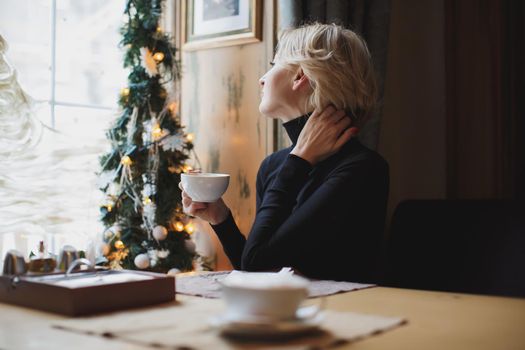 Beautiful woman drinking coffee in a cafe