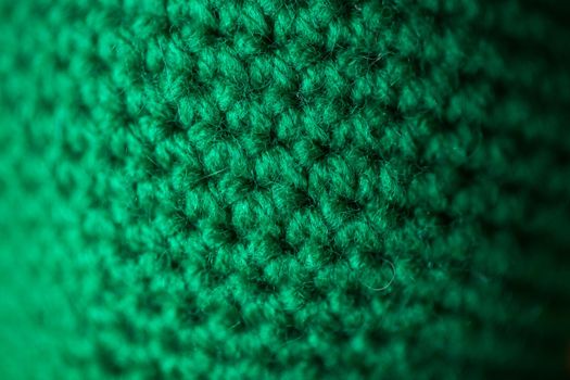 Green knitted wool texture can use as background.