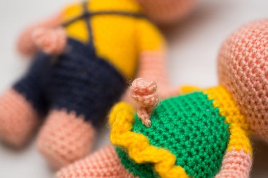 Knitted piglets toys for a child. A symbol of the New Year.