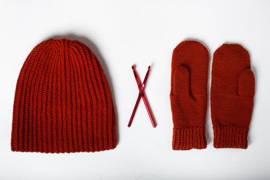knitted hat with gloves red on a white background