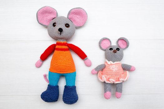 A knitted mouse. A soft toy as a symbol of the New Year.