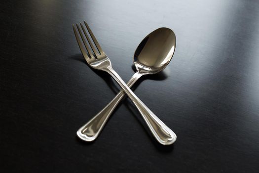 Cutlery on a black background. Fork, spoon knife