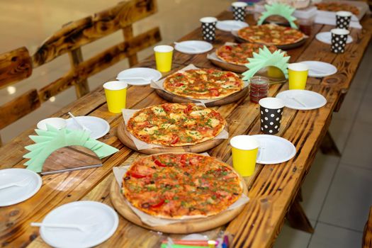 Pizza and juice on the birthday table