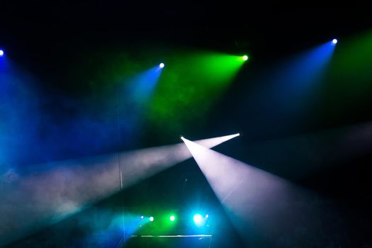 beautiful light spotlights in the circus on a black background