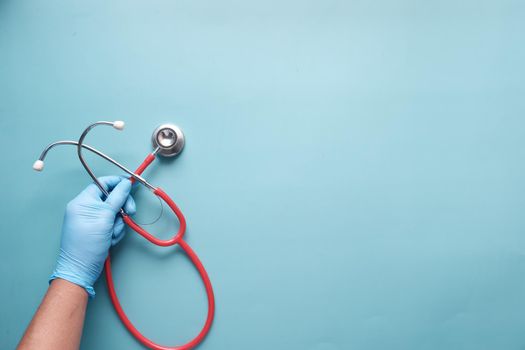 Close up of doctor hand using stethoscope