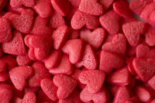 Small red candy hearts, close-up. Macro photography.