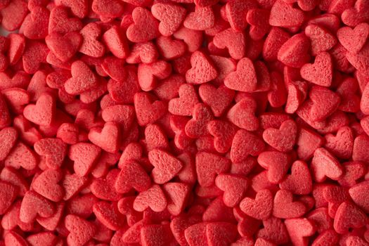 Small red candy hearts, close-up. Macro photography