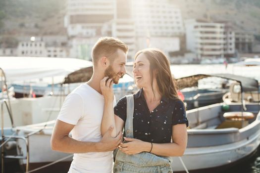 Boy and girl, walk on a wooden pier