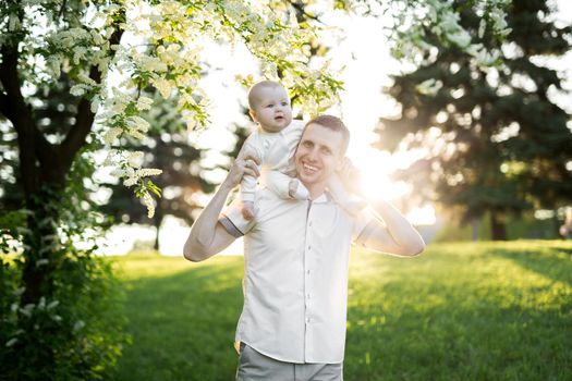 Dad and child together on nature in summer day