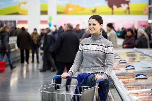 A young woman shopping in a supermarket