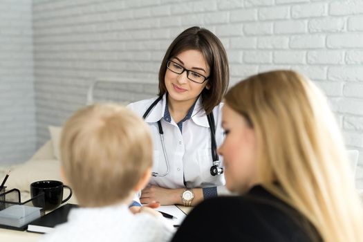 Pediatrician Meeting With Mother And Child In Hospital