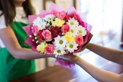 florist will give the client a beautiful flower bouquet