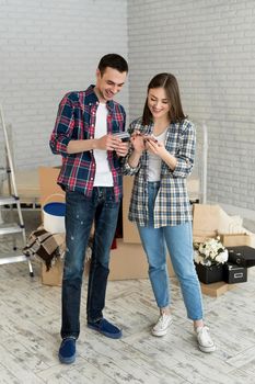 Couple buying online with credit card and phone