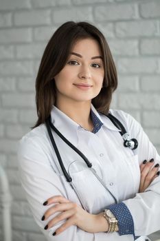 Portrait of happy smiling doctor woman with stethoscope
