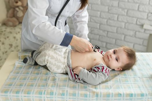 Doctor listens to the heart with stethoscope