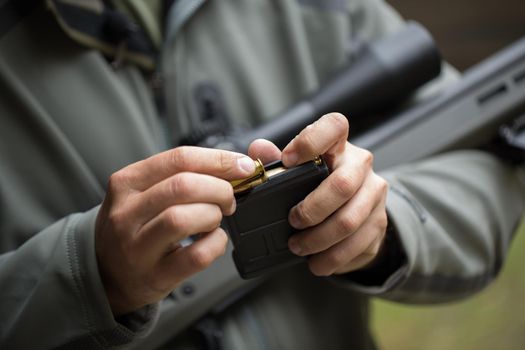 Loading ammunition into a clip. Reloading weapons