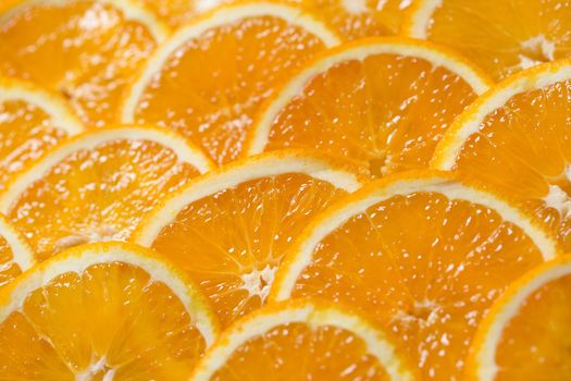 Bright orange background from slices of juicy Orange. Healthy food, background.