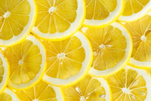 A slices of fresh yellow lemon texture background pattern