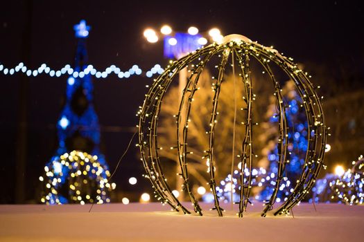 Christmas tree on the main Square on a winter night in snow