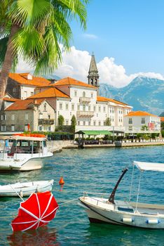 Famous Perast bell tower in sunny summer day