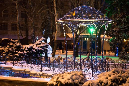 Christmas tree on the main Square on a winter night in snow