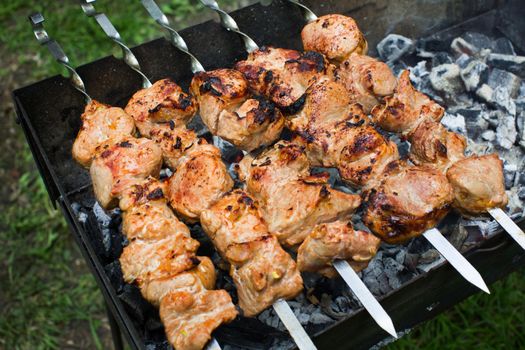 Beef and pork barbecue, steak on the grill. Kebab on a skewer. Nature.