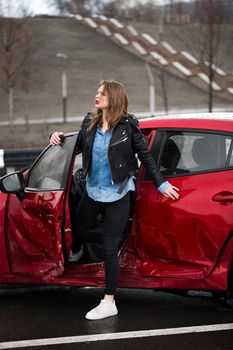 Young pretty scared woman in the car. Injured woman feeling bad after having a car crash