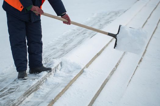 Workers sweep snow from road in winter, Cleaning road from snow storm.