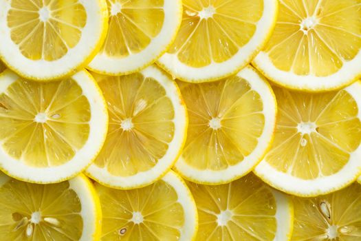 A slices of fresh yellow lemon texture background pattern