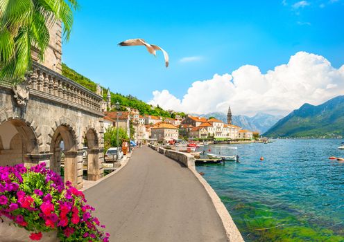 Famous Perast bell tower in sunny summer day