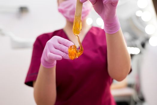 Sugar paste for hair removal close-up in a beauty salon