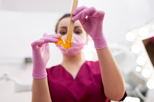 Sugar paste for hair removal close-up in a beauty salon