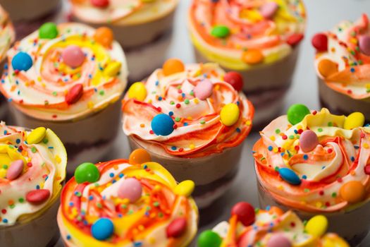 Chocolate and mousse trifle dessert in plastic cups.