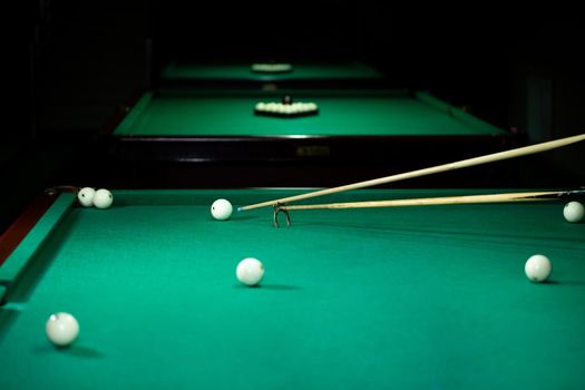 Billiard balls in a green pool table