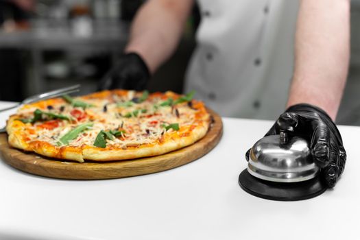 Cook with a ready-made dish with pizza.