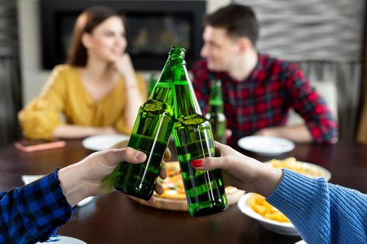 Bottles of beer.Group of friends enjoying party.people are drinking beer and laughing.