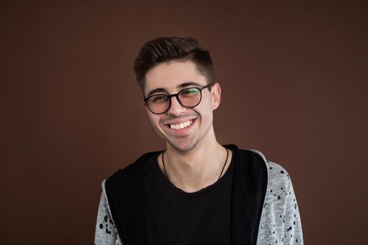 Portrait of laughing young man. Happy guy smiling.
