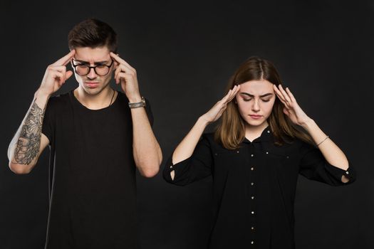 Man and woman feeling stressed and angry at each other, frustrated couple hands on head, not talking after dispute, teenagers quarrel, family crisis and relationships problems