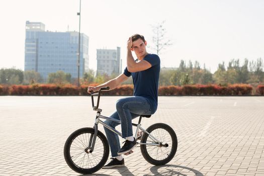 Young urban bmx racer in the city