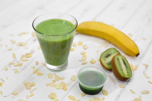 Whitegrass smoothie, banana and kiwi. Detoxification Wheat