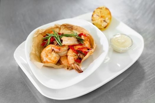 Ready-made dish with shrimp on the kitchen table