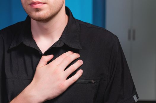 Close-up of a male massage therapist doing self-massage of the pectoral muscle. Lymphatic drainage massage.