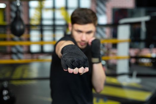 Close-up of the boxer's hand is ready to fight. The concept. Strong hands and clenched fists