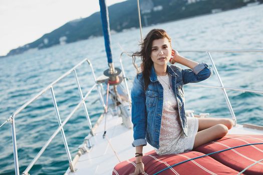 Attractive girl on a yacht at sea