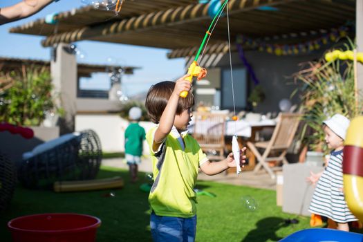 Fishing in the children's pool. Little boy's games.